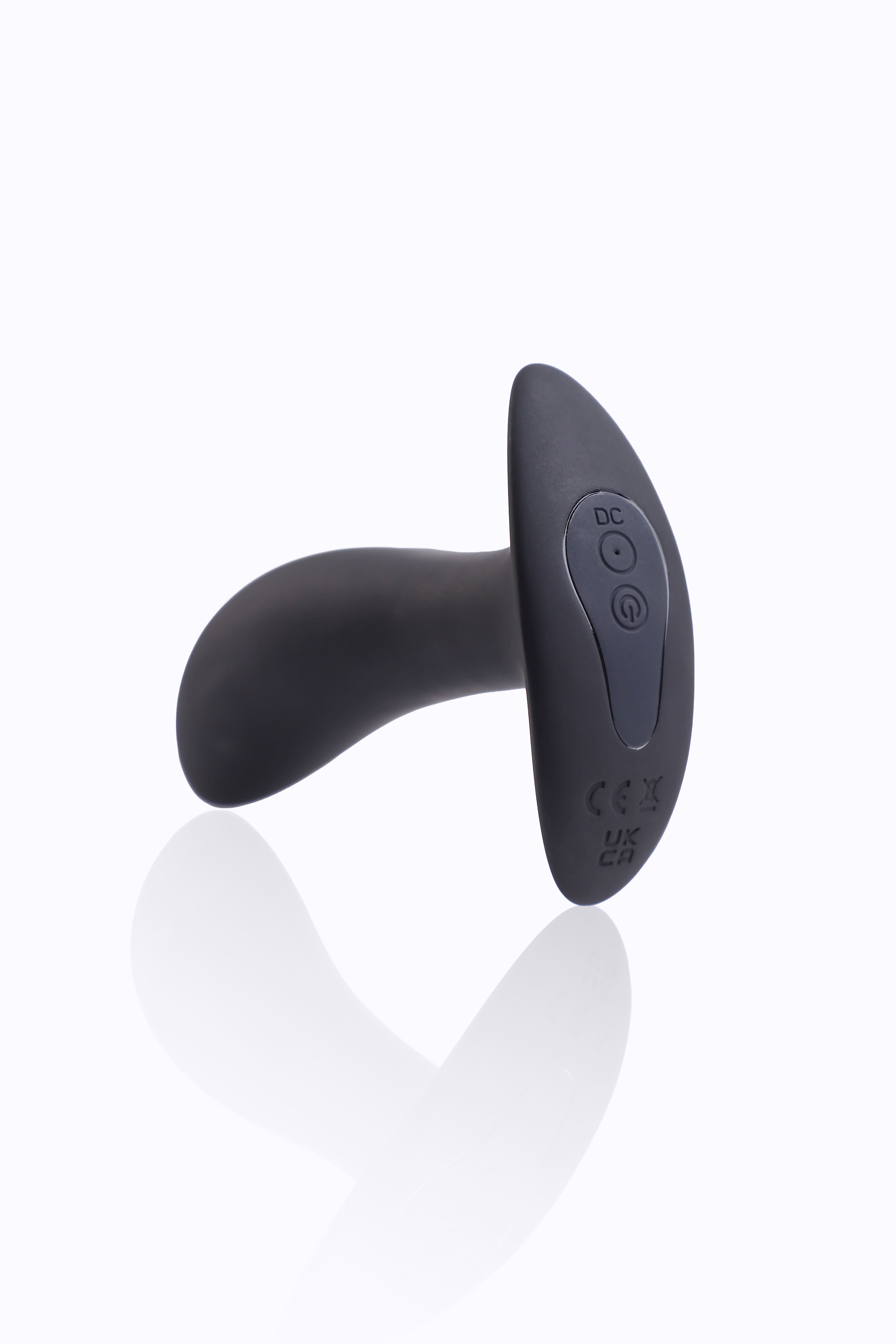 bottom end of shock butt plug with magnetic charging contacts